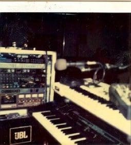 Music studio with keyboards and audio equipment.