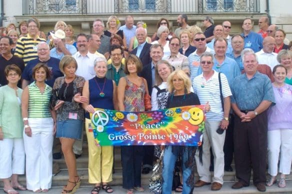 Group photo with a "Peace" banner.
