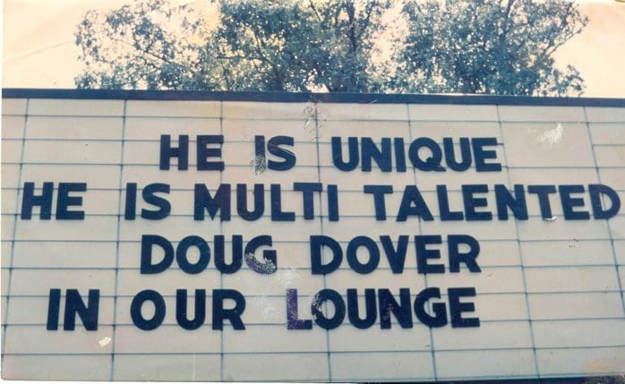 Sign promoting Doug Dover in lounge.