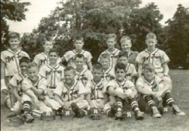Youth baseball team posing outdoors, vintage photo.