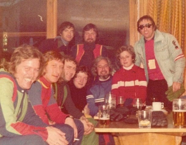 Group of friends in colorful ski outfits.
