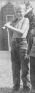 Black-and-white photo of a person in jeans and a belt.