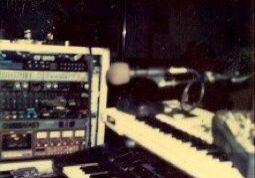 Music studio with keyboards and audio equipment.