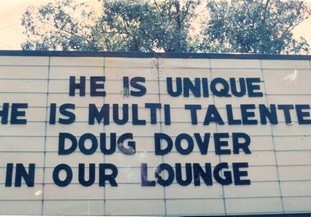 Sign promoting Doug Dover in lounge.