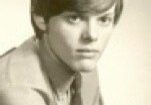 Young man in vintage black and white portrait.