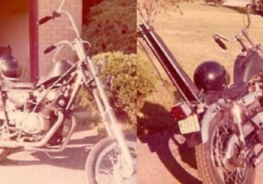 Vintage motorcycles with helmets in the sunlight.