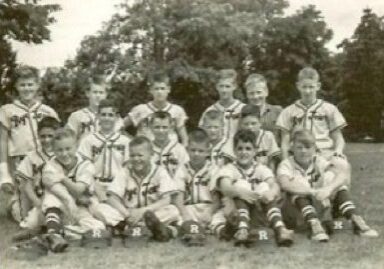 Youth baseball team posing outdoors, vintage photo.