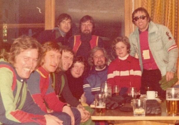 Group of friends in colorful ski outfits.